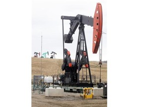 Colleen De Neve/Calgary Herald Pumpjacks ring the hills around Legacy Oil + Gas Inc. site southwest of Turner Valley.
