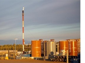 A flare stack burns off excess gasses at the Cenovus Energy Christina Lake SAGD oilsands facility near Conklin, Alta., in this file photo. The Canadian Association of Petroleum Producers has trimmed its forecast for oilsands production due to rising costs and competitiveness.