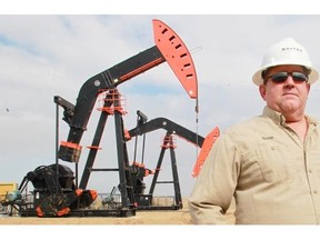 Contractor Donn Campbell poses at a Baytex Energy well site near Crosby, N.D., in a 2012 photograph.