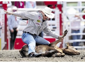Tuf Cooper ropes a calf at the Stampede rodeo on Monday. Reader says Stampede animals are well cared for.