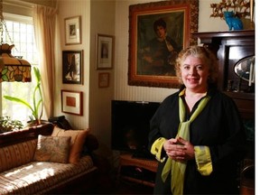 Cory Miller stands in the living room of her 1912 Elbow Park home which underwent restoration repairs following the flood of 2013. (Gavin Young/Calgary Herald)