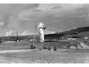 Courtesy, Glenbow Archives — NA-67-87 
 View of the Turner Valley oilfield and flare in the 1930s. The glow at night could be seen for miles around.