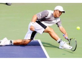 Daniel Nguyen lunges for a shot against fellow American Bjorn Fratangelo during the men’s singles final of the ITF Futures tournament at the Calgary Tennis Club on Sunday. Nguyen won the title and the $2,160 first-place cheque.