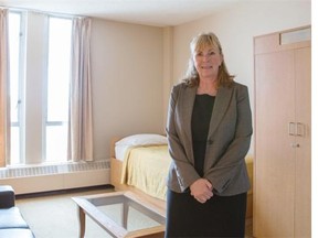 Debbie Newman, Executive Director of the Calgary Drop-In and Rehab Centre, displays one of the rooms at the vacant Quality Inn which will be turned into transitional housing.