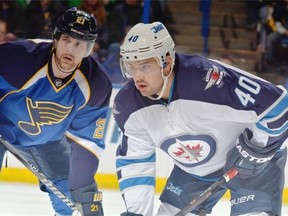Devin Setoguchi squares off against the S. Louis Blues during a game last season as a member of the Winnipeg Jets.