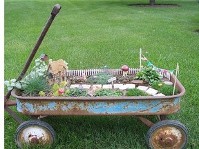 DIYforlife.com 
 Many of the fairy gardens you will find have been created in discarded containers. This rusty wagon is the perfect spot for a nice sized garden.