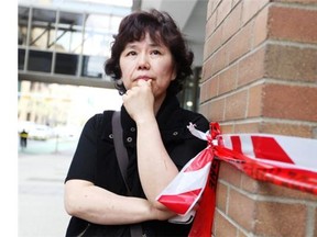 Downtown Calgary tenant Carolyn Kim is facing weeks of is facing weeks of lost business with no insurance coverage after the building was evacuated. (Colleen De Neve/Calgary Herald)