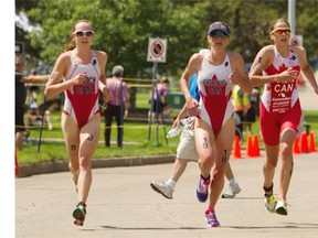 Ellen Pennock, left, competes alongside Canadian teammates Kirsten Sweetland and Amelie Kretz at the International Triathlon Union’s World Cup Race on last June in Edmonton.