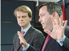 Employment Minister Jason Kenney speaks at a news conference in Ottawa on Friday, June 20, 2014 on reforms to the Temporary Foreign Worker Program. To his right is Citizenship and Immigration Minister Chris Alexander.