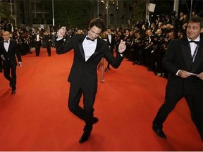 Actor Adrien Brody poses for photographers as he arrives for the screening of Coming Home (Gu Lai) at the 67th international film festival, Cannes, southern France, Tuesday, May 20, 2014. (AP Photo/Thibault Camus)