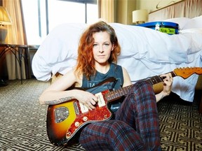 This July 9, 2013 photo shows singer-songwriter Neko Case posing at a hotel in New York. Case's latest album, "The Worse Things Get, the Harder I Fight, the Harder I Fight, the More I Love You," was released this week. (Photo by Dan Hallman/Invision/AP)
