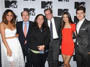 FILE - This April 24, 2014 file photo shows, from left, Chrissy Teigen of MTV's "Snack Off", CEO of Viacom Philippe Dauman, President of Programming for MTV Susanne Daniels, COO of Viacom Tom Dooley, Victoria Justice of MTV's "Eye Candy" and Gregg Sulkin of MTV's "Faking It" during the 2014 MTV Upfront Presentation in New York. MTV is maturing into a more traditional television network with a broad mix of scripted and reality programming and, in Daniels, has a seasoned television executive in charge of content. (AP Photo/ MTV, Scott Gries, File)