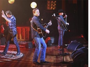 This image released by ABC shows, from left, Will Chase, Charles Esten and Chris Carmack performing on a special "Nashville: On the Record," episode at the Ryman Auditorium, in Nashville, Tenn. All original music from the show is released by ABC Studios, Lionsgate and ABC Music Lounge in association with Big Machine Records. Now is a nerve-jangling time for actors and creators of television shows, one week before the biggest broadcast networks reveal their plans for next season. The wait is particularly intense for series, like "Nashville," that are considered on the bubble between returning and having the plug pulled. A thumbs-down from ABC not only ends a televised soap opera, but a growing music franchise as well. (AP Photo/ABC, Mark Levine)