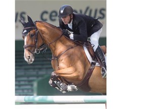 Eric Lamaze rides Fine Lady 5 to victory at the $33,500 ATCO Energy Solutions Cup at the Spruce Meadows North American tournament in Calgary.