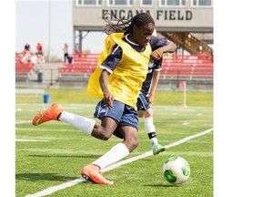 Ethan Monaghan, age 15, participates in drills during an international soccer ID Camp at Shouldice Park in Calgary on Friday.