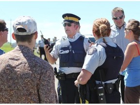 Evacuees confronted the RCMP on the northwest corner of town  in a bid to enter the Town of High River on Thursday, June 27th 2013.