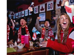 Fans react to Canada’s 3-0 victory over Sweden in men’s hockey gold medal finals at the Olympics in February. Gerard Curran, chair of the lobby group Restaurants Canada, believes that liquor laws in Alberta could be further loosened for next year’s Calgary Stampede.