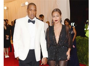 FILE - This May 5, 2014 file photo shows Jay Z, left, and Beyonce at The Metropolitan Museum of Art's Costume Institute benefit gala celebrating "Charles James: Beyond Fashion" in New York. The Standard Hotel in New York City says it is investigating the leak of a security video that appears to show Beyonce's sister, Solange, attacking Jay Z. Asked about the video on Monday, May 12, by The Associated Press, the hotel issued a statement saying it is "shocked and disappointed that there was a clear breach of our security system." (Photo by Evan Agostini/Invision/AP, File)