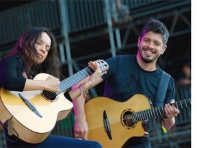FILE - This June 8, 2012 file photo shows Gabriela Quintero, left, and  Rodrigo Sanchez of Rodrigo Y Gabriela performing during the Bonnaroo Music and Arts Festival in Manchester, Tenn. The group released a new album titled, "9 Dead Alive." (AP Photo/Dave Martin)