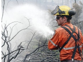 Fire Crews from Ontario target smouldering hot spots from the Spreading Creek Wildfire on the northeastern edge of Banff National Park. The fire is contained to an area roughly the size of Red Deer.