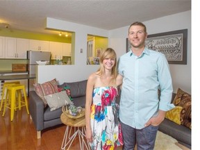 First-time home buyer Mark Kolentsis, and girlfriend Stephanie McLean in their new condo in Calgary.