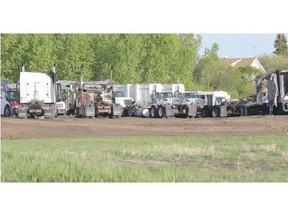 Flames ripped through four tractor trailers in a remote area, southeast of Calgary on Friday night. (Stuart Gradon/Calgary Herald)