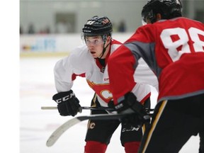 Flames rookie Sam Bennett lines up for a faceoff during Monday’s camp scrimmage.