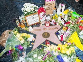 Flowers are placed on Robin Williams’ Hollywood Walk of Fame star on Tuesday in Los Angeles, Calif. Williams’ death is a clarion call for an end to the silence and stigma surrounding depression, says the Herald editorial board.