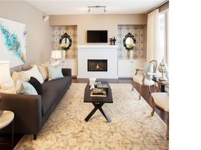 The focal point of the great room in the Slate by Brookfield Residential in Cranston is a fireplace flanked by built-in cabinets.