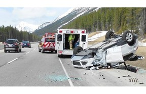 A Ford Escape SUV (pictured) ended up on its roof after drifting off Highway 1 and clipping a parked Toyota Prius on the shoulder off the road. The driver of the Escape and a boy who was in the Prius were taken to hospital in Banff with minor injuries.