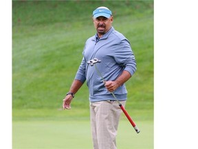 Former Edmonton Oilers goaltender, Grant Fuhr, grimaces as his putt goes wide during the Shaw Charity Classic Pre-qualifying tournament at the Hamptons Golf Club in Calgary on Thursday. He wasn’t among the five players who qualified for Tuesday’s official tournament qualifying tournament.