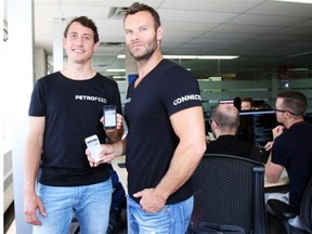 Founders Ashley Dunfield, left, and Troy Bilon supervise operations at software startup PetroFeed on Monday. The company has a rig-finding app that is being frequently downloaded.