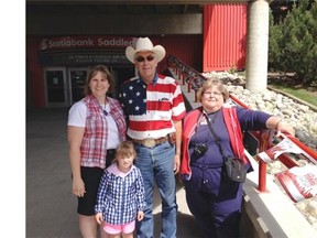 From left Anne and Greg Simmet stand next to Melissa Brown and child Morgan brown. The family drove all the way from Minnesota for a weekend in Calgary. 
  
 Dylan Robertson/Calgary Herald