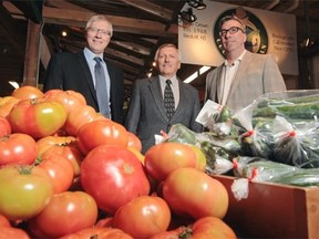 From left, Verlyn Olson, Minister of Agriculture and Rural Development, Erwin Braun, general manager at Western Irrigation District, and John Kollmel, chair at Calgary Farmers’ Market, at Calgary Farmers Market in Calgary on Thursday, May 8, 2014.
