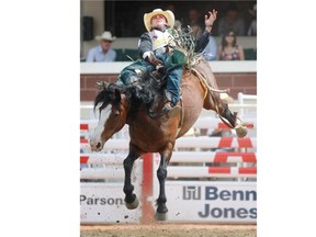 Gavin Young, Calgary Herald 
 CALGARY, AB: JULY 04, 2014 -- Richie Champion from Woodlands TX competes in the bareback event on the first day of the 2014 Calgary Stampede rodeo on Friday July 4, 2014. 
 Gavin Young/Calgary Herald 
 (For Sports section story by TBA) Trax# 00056704A