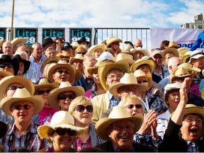 A general view of the crowds sporting their cowboy hats at the 2013 Stampede Parade on Friday, July 5, 2013.