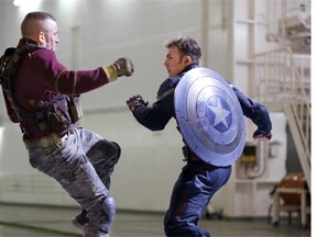 Georges St-Pierre, left, and Chris Evans in Captain America: The Winter Soldier. Expect more sequels.