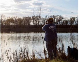 Gerardo Gamillo fishes on the Bow River in Carburn Park. Environment officials say despite some damage from last June’s flood, the river remains a “world class fishery.”