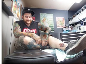 Sal Girimonte has a Stampede-themed tattoo put on his ankle by his brother Joseph at Calgary’s Gypsy Rose Tattoos on Thursday.