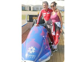 Golfer David Frost and his wife Colene stop for a photo after they crossed the finish line in the summer bobsleigh at Winsport on Wednesday. Frost won’t be giving up his day job, which is a pretty good one: playing pro golf.