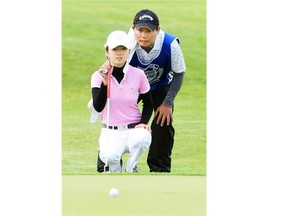 Golfer Jennifer Ha, seen here four years ago with her father John, will be attempting to win the Alberta Ladies Amateur in Mundare.