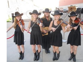 Great entertainment, food and libation were but a few of the highlights. Pictured, from left, are Keister family fiddlers Faith, Claire, mom Sherry, Quinn and Paige Keister.