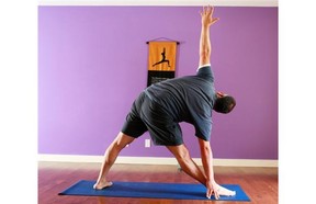 Hart Steinfeld demonstrates the Trikonasana or triangle pose.