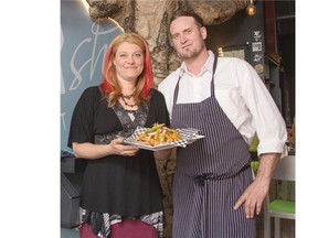 Heather McCoy, left, and Mark Gyles, right, owners of Nourish pose in their restaurant in Banff on June 3, 2014.