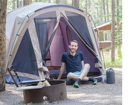 Herald reporter Dylan Robertson relaxes in his Parks Canada Equipped Campsite in Banff National Park. Equipped Campsites come set up with a tent, sleeping pads, a propane stove and a camping 101 orientation.