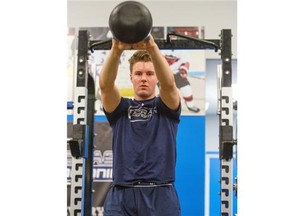 Hitmen defencemen Ben Thomas, who is ranked 86th among North American skaters in Central Scouting, works on his conditioning at Crash Conditioning before the upcoming NHL draft.