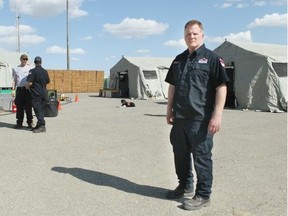 Jamie Hannaford, task force leader, with some of the tents set up for sleeping. It is part of a mock emergency exercise taking place in High River May 9 to 10.
