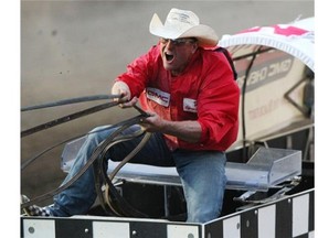 Jason Glass rounds the barrels during the GMC Rangeland Derby at the 2013 Calgary Stampede. The High River product won the event a year ago for the first time in his career.