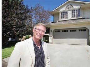 Jayman MasterBuilt co-founder Jay Westman outside one of the company's most popular models in the early 80s in the community of McKenzie, a five-level split called the Silver View. 
 Wil Andruschak for the Herald