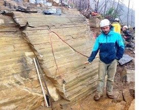 Jean-Bernard Caron shows the layers of the fossil bed near Marble Canyon in Kootenay National Park.